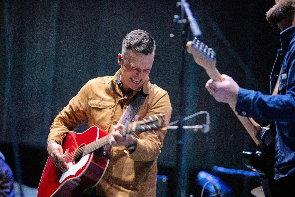 American Aquarium’s BJ Barham (left) jams on stage at the Band Together Mighty Giveback concert, Friday night, Oct. 28, 2022.