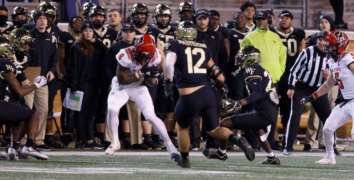 N.C. State’s Ricky Person Jr. (8) is called for illegal touch of a kick on an onside kick in the final minute of Wake Forest’s 45-42 victory over N.C. State at Truist Field in Winston-Salem, N.C., Saturday, November 13, 2021.