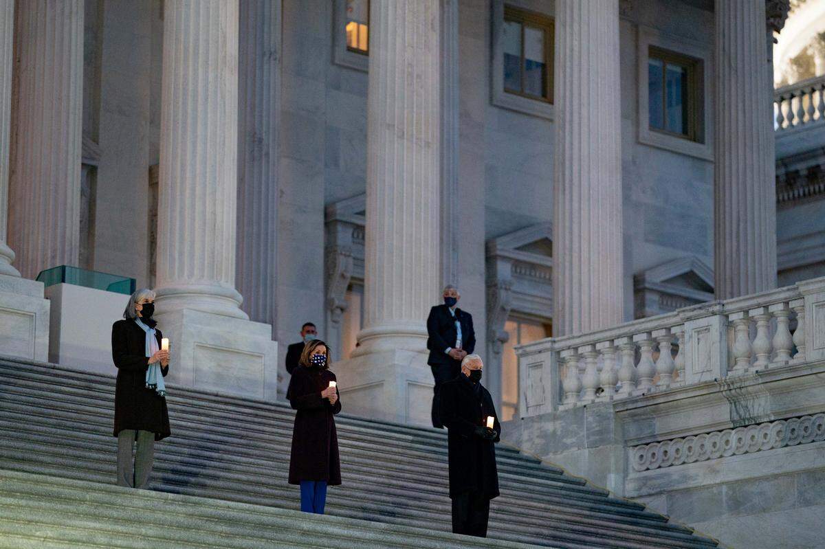 Speaker of the House Nancy Pelosi (D-Calif.), center, and the House Democratic leadership, at Lincoln Monument Reflecting Pool during a COVID-19 memorial event in Washington on Tuesday evening, Jan. 19, 2021.