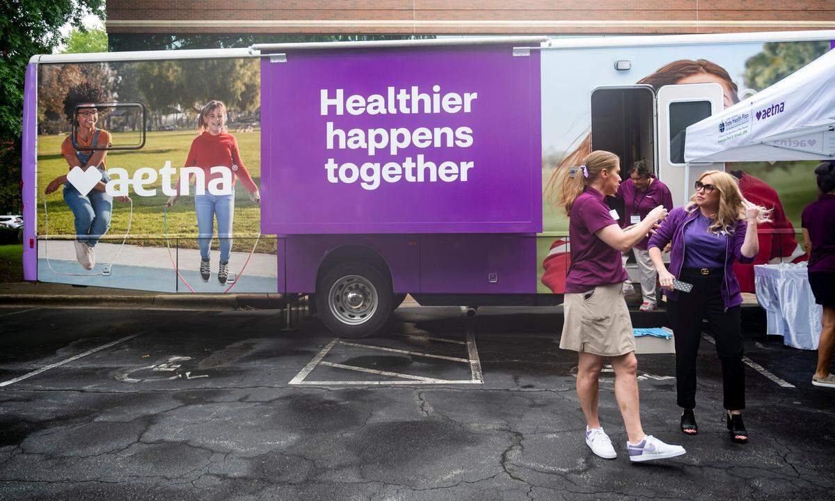The Aetna bus parked outside the Department of State Treasurer’s office in Raleigh for the Aetna tour kick off on Thursday, July 25, 2024. Inside the bus there is space for people to undergo blood pressure screenings and body composition measurements.