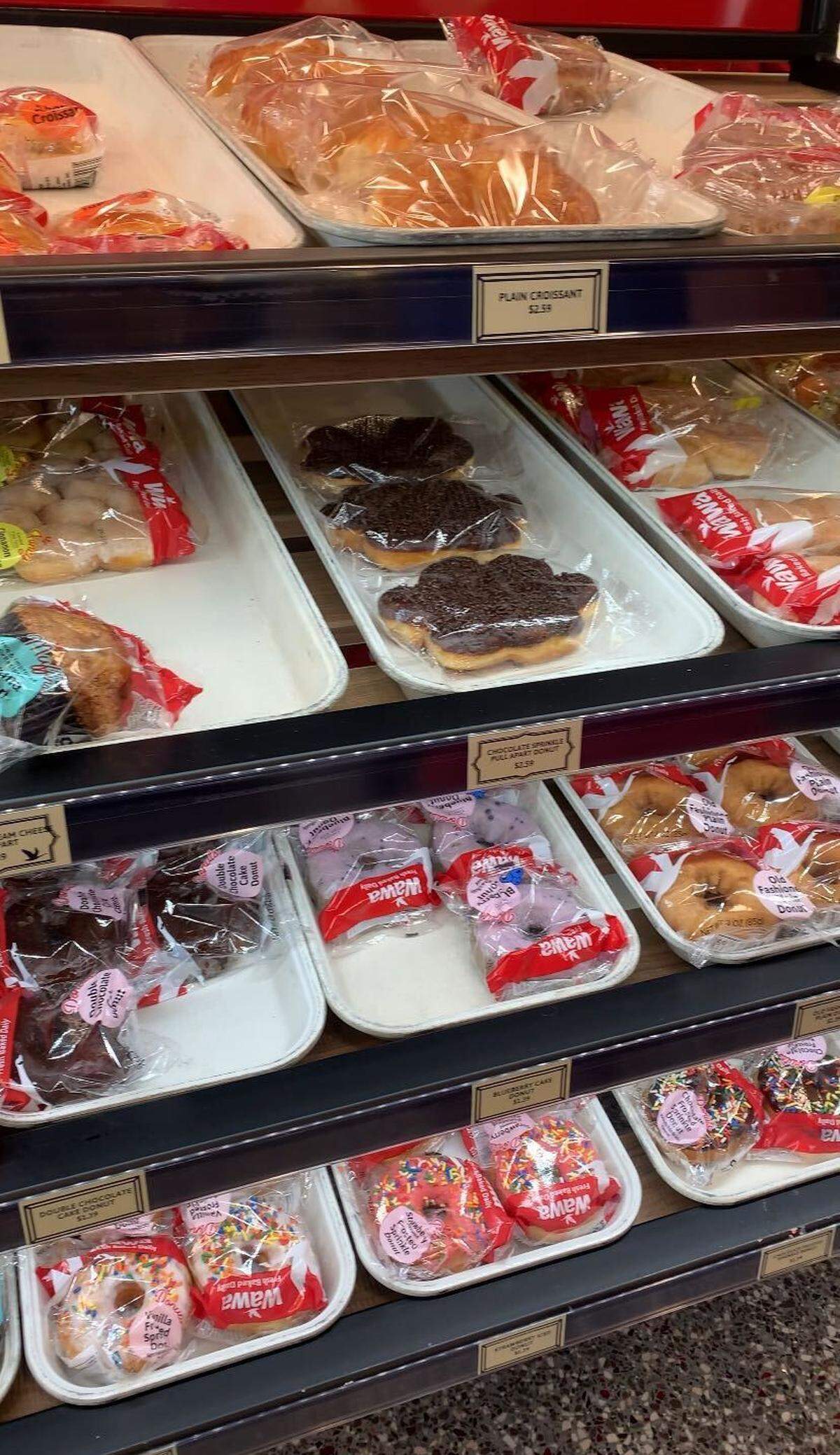A pastry bar at the new Wawa features wrapped doughnuts in assortment of flavors.