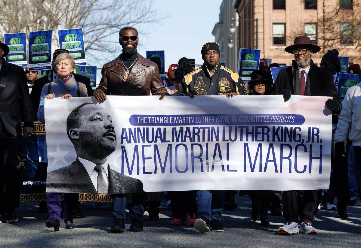 Crowds walk through downtown Raleigh during the 46th Annual Martin Luther King Jr. Memorial March on Monday, Jan. 19, 2026, in Raleigh, N.C.