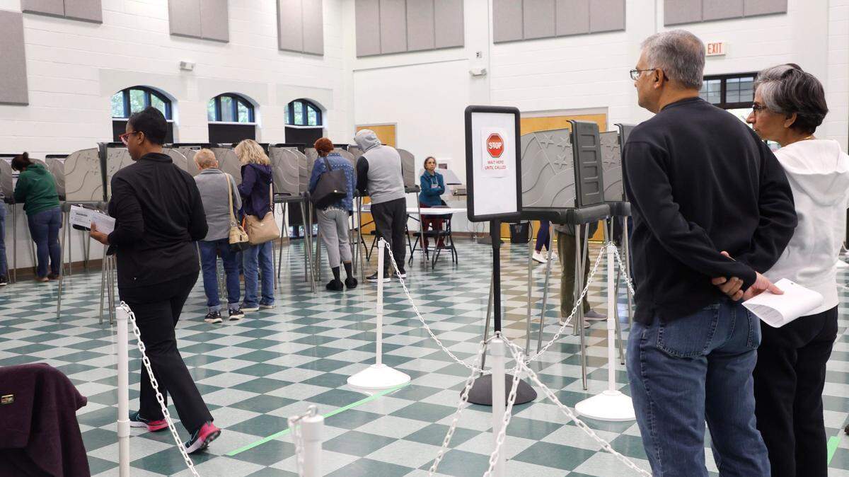 Voters wait at the early voting site at the Cary Senior Center on Oct. 28, 2022. GOP lawsuits are seeking to have more than 200,000 people removed from NC voter registration lists.
