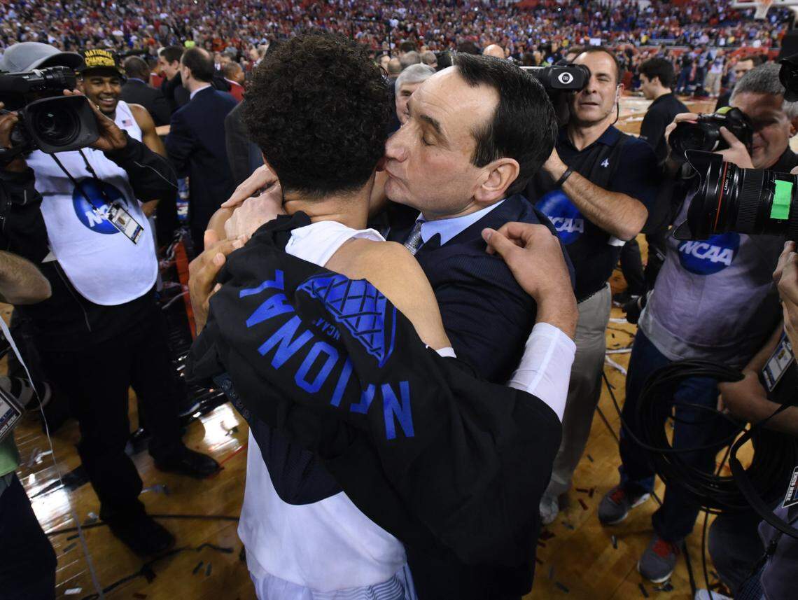 Duke head coach Mike Krzyzewski hugs Duke’s Tyus Jones (5) after Duke’s 68-63 victory over Wisconsin in the 2015 Division I Men’s Basketball Championship game at Lucas Oil Stadium in Indianapolis, Ind., Monday, April 6, 2015.