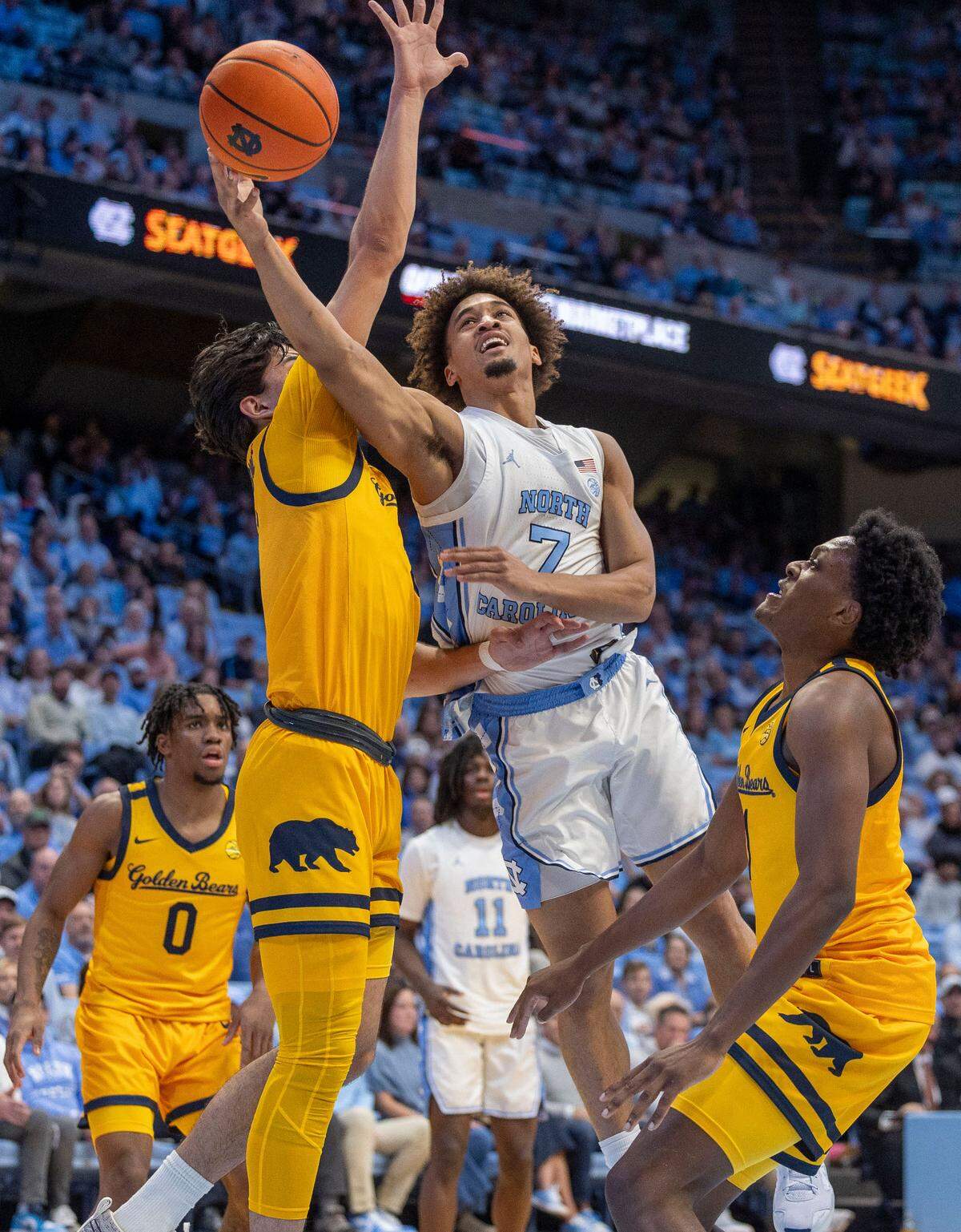 North Carolina guard Seth Trimble (7) drives to the basket against Andrej Stojakovic (2) in the first half on Wednesday, January 15, 2025 at the Smith Center in Chapel Hill, N.C.