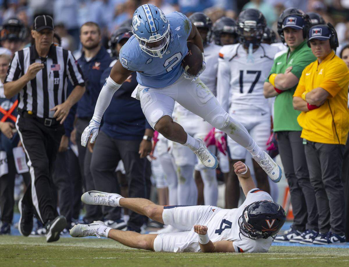 North Carolina linebacker Andrew Simpson (2) returns an interception of Virginia quarterback Chandler Morris 16 yards in the third quarter on Saturday, October 25, 2025 at Kenan Stadium in Chapel Hill, N.C.