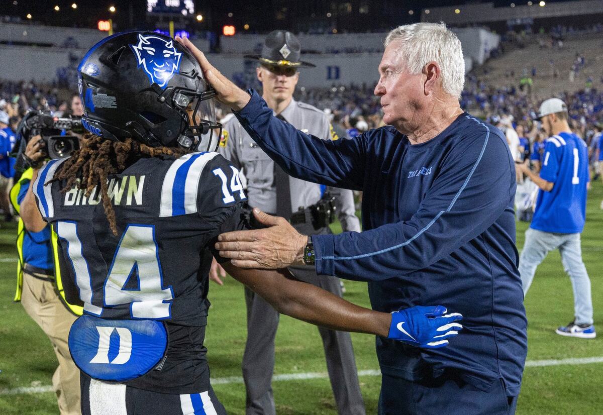 North Carolina coach Mack Brown congratulates Duke defensive end Michael Reese following the Tar Heels’ 21-20 loss to Duke on Saturday, September 28, 2024 at Wallace Wade Stadium in Durham, N.C.