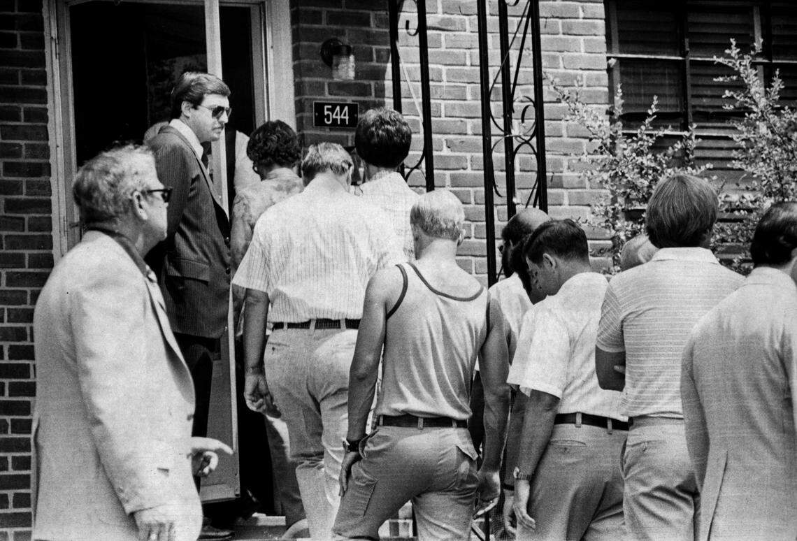 A 1979 file photo shows jurors in the murder trial of Dr. Jeffrey MacDonald entering the murder scene at 544 Castle Drive at Ft. Bragg, N.C.