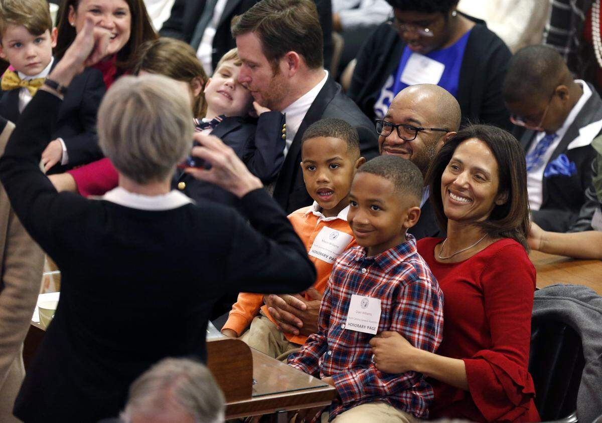 Rep. Sydney Batch, with her husband J. Patrick Williams and sons Mason and Grant, have their photo taken as the N.C. General Assembly convenes in Raleigh, N.C., Wednesday, January 9, 2019.
