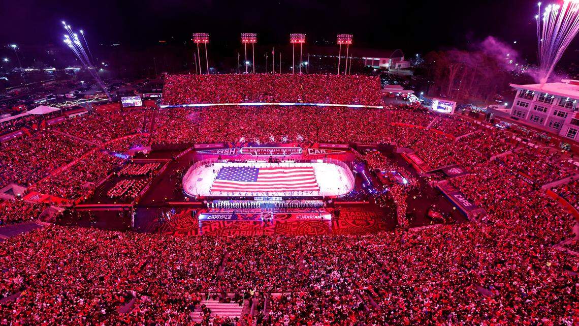 Fireworks go off during the national anthem before the NHL Stadium Series game between the Carolina Hurricanes and the Washington Capitals at Carter-Finley Stadium in Raleigh, N.C., Saturday, Feb. 18, 2023.