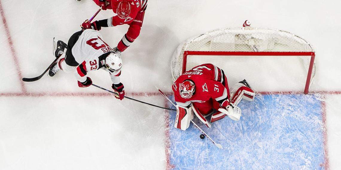 Carolina Hurricanes goalie Frederik Andersen (31) stops a scoring attempt by New Jersey Devils Ryan Graves (33) in the first period during Game 2 of their second round Stanley Cup playoff series on Friday, May 5, 2023 at PNC Arena in Raleigh, N.C. Andersen made 28 saves in the Hurricanes’ 6-1 victory.