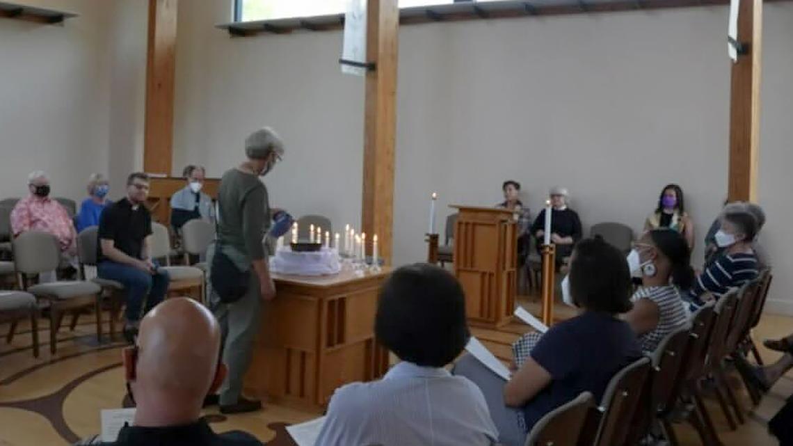 A Pullen Memorial Baptist Church member pours water into an overflowing bowl as an “offering of tears” for those impacted by the Supreme Court’s decision to overturn Roe v. Wade.