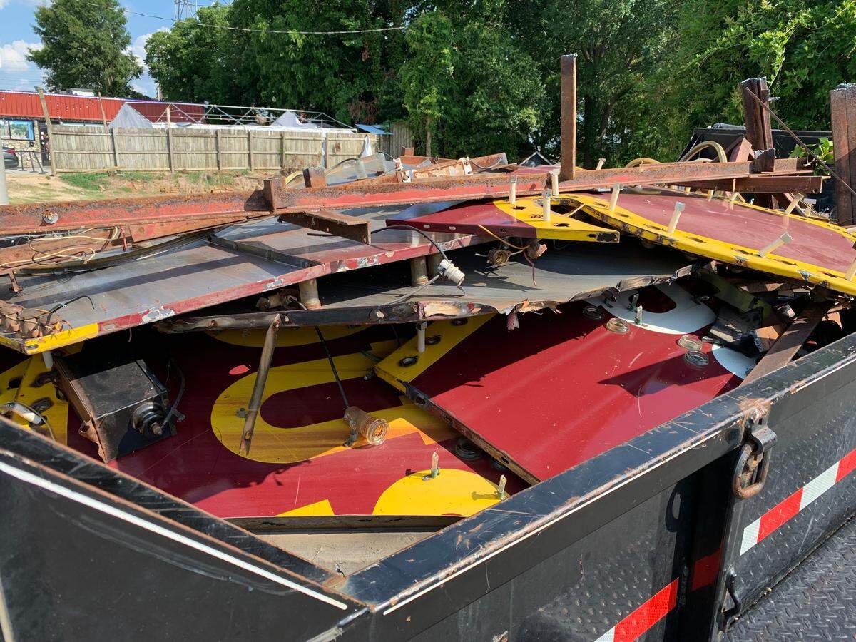 Pieces of the old Arby’s Roast Beef sign lie in a trailer outside the shuttered restaurant on Hillsborough Street in Raleigh. The cowboy hat sign, which had stood for decades, was taken on July 6, 2022.
