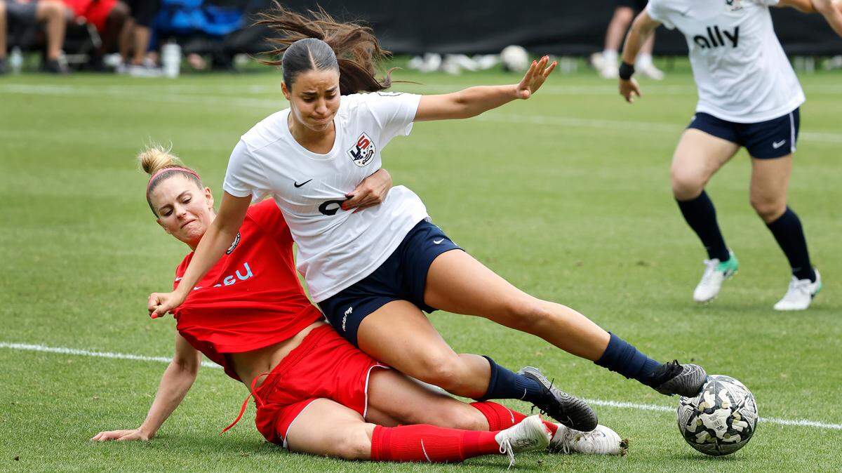Streetball FC Canada’s Lauren Sesselmann (4) takes down US Women’s Tori Dellaperuta (19) during Streetball FC Canada’s 3-0 victory over the US Women during the TST Soccer Tournament at WakeMed Soccer Park in Cary, N.C., Friday, June 7, 2024.