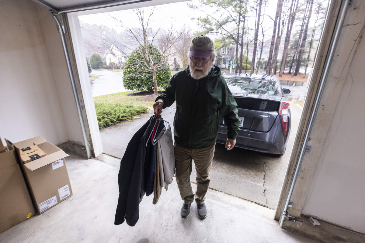 Peter Burke moves personal belongings into his newly renovated 1,380-square-foot home in the Weatherhill Pointe neighborhood in Carrboro on Thursday, Feb. 26, 2026.