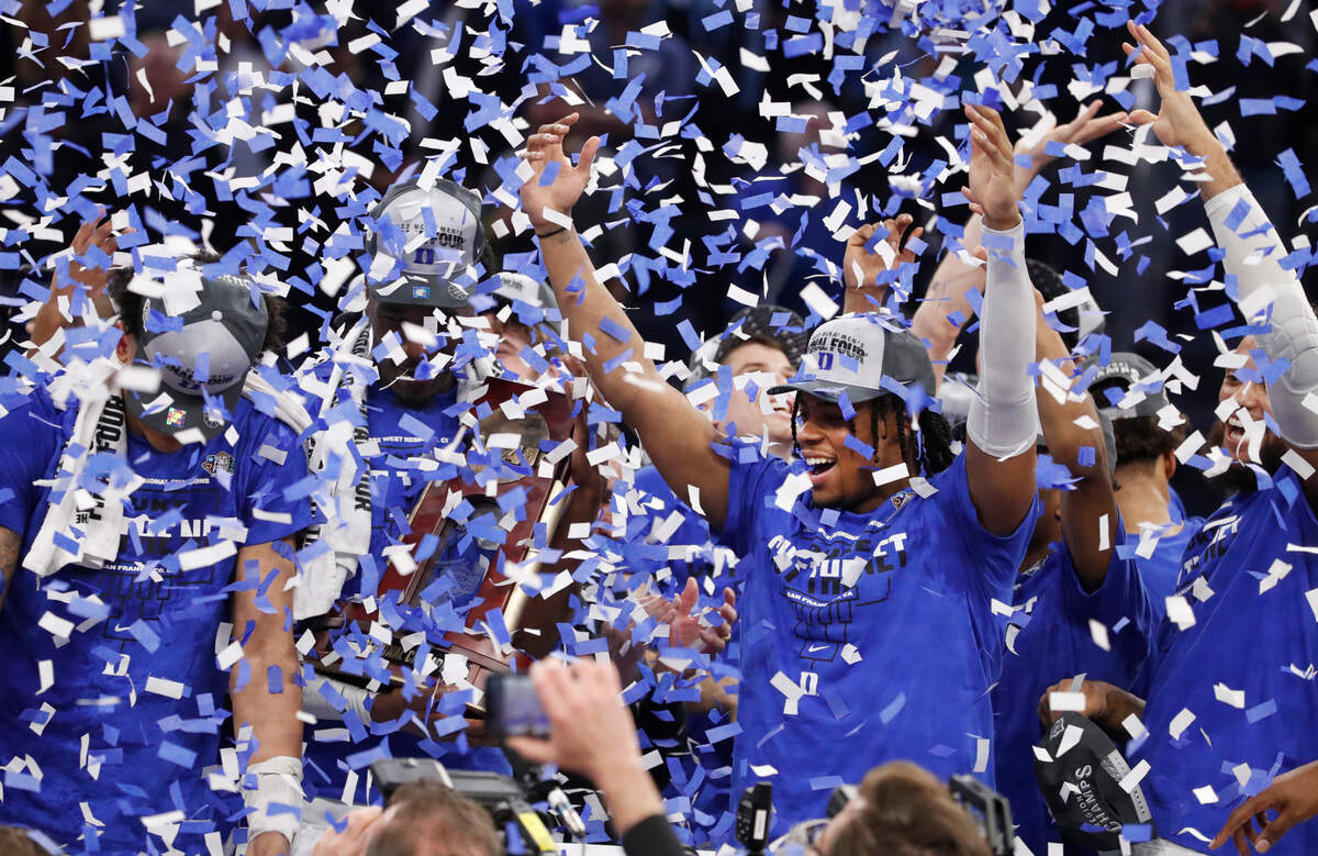 Duke’s Trevor Keels and the team celebrate after Duke’s 78-69 victory over Arkansas in the NCAA Tournament West Regional finals at the Chase Center in San Francisco, Calif., Saturday, March 26, 2022.