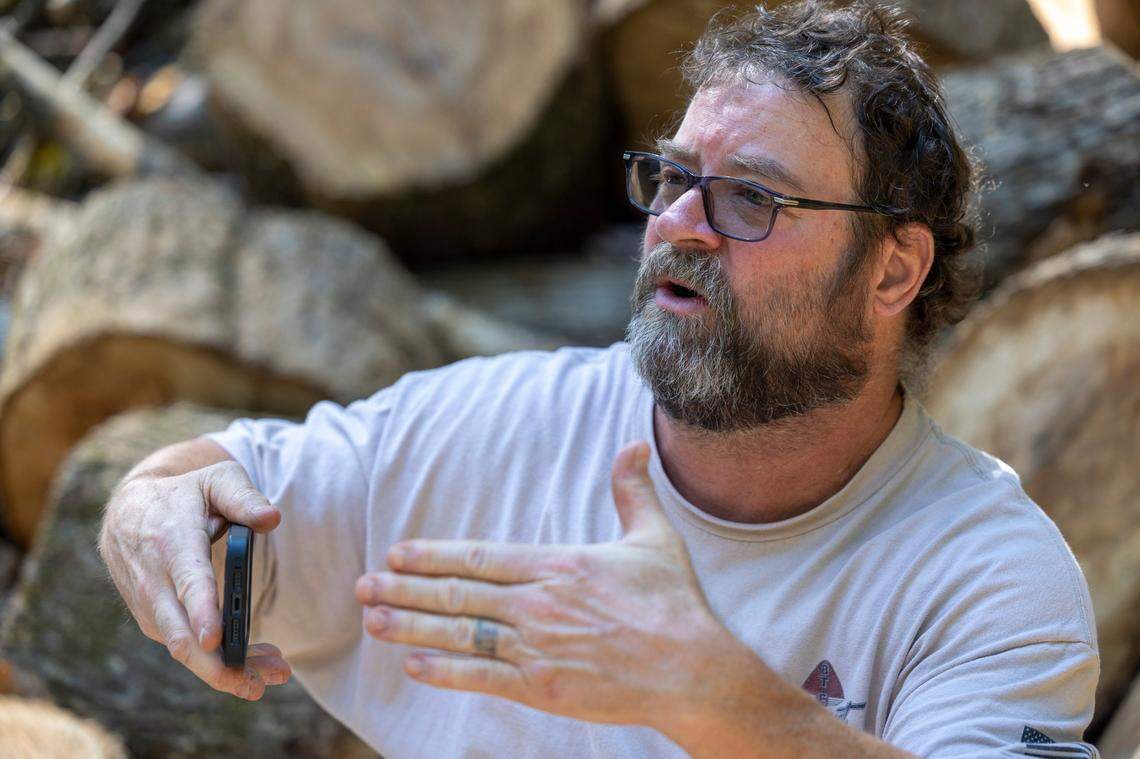 Michael Bell describes how he rode out Hurricane Helene at his home off of US 176 near Tryon, N.C., on Monday, October 7, 2024.