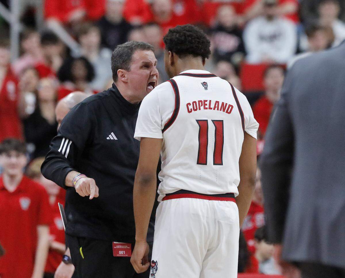 N.C. State head coach Will Wade talks with Quadir Copeland during the first half of the Wolfpack’s 78-74 loss to Georgia Tech on Saturday, Jan. 17, 2026, at Lenovo Center in Raleigh, N.C. 