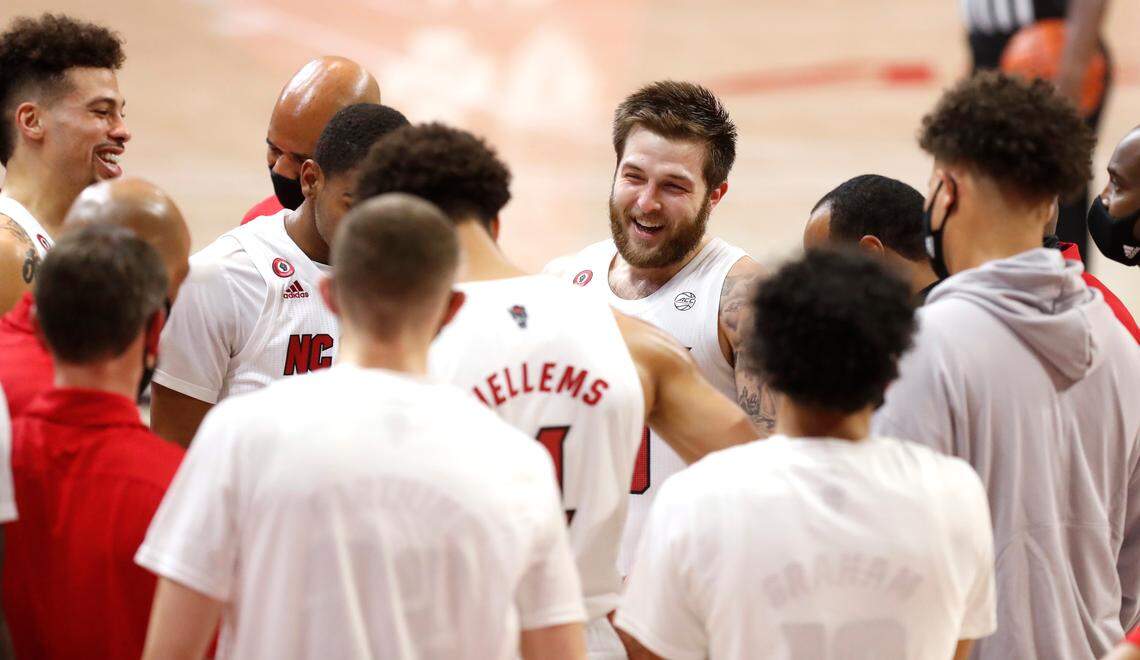N.C. State’s Braxton Beverly (10) laughs as he comes into the huddle after he received a hard foul during the second half of N.C. State’s 95-61 victory over Charleston Southern in the Wolfpack Invitational at Reynolds Coliseum in Raleigh, N.C., Wednesday, Nov. 25, 2020.