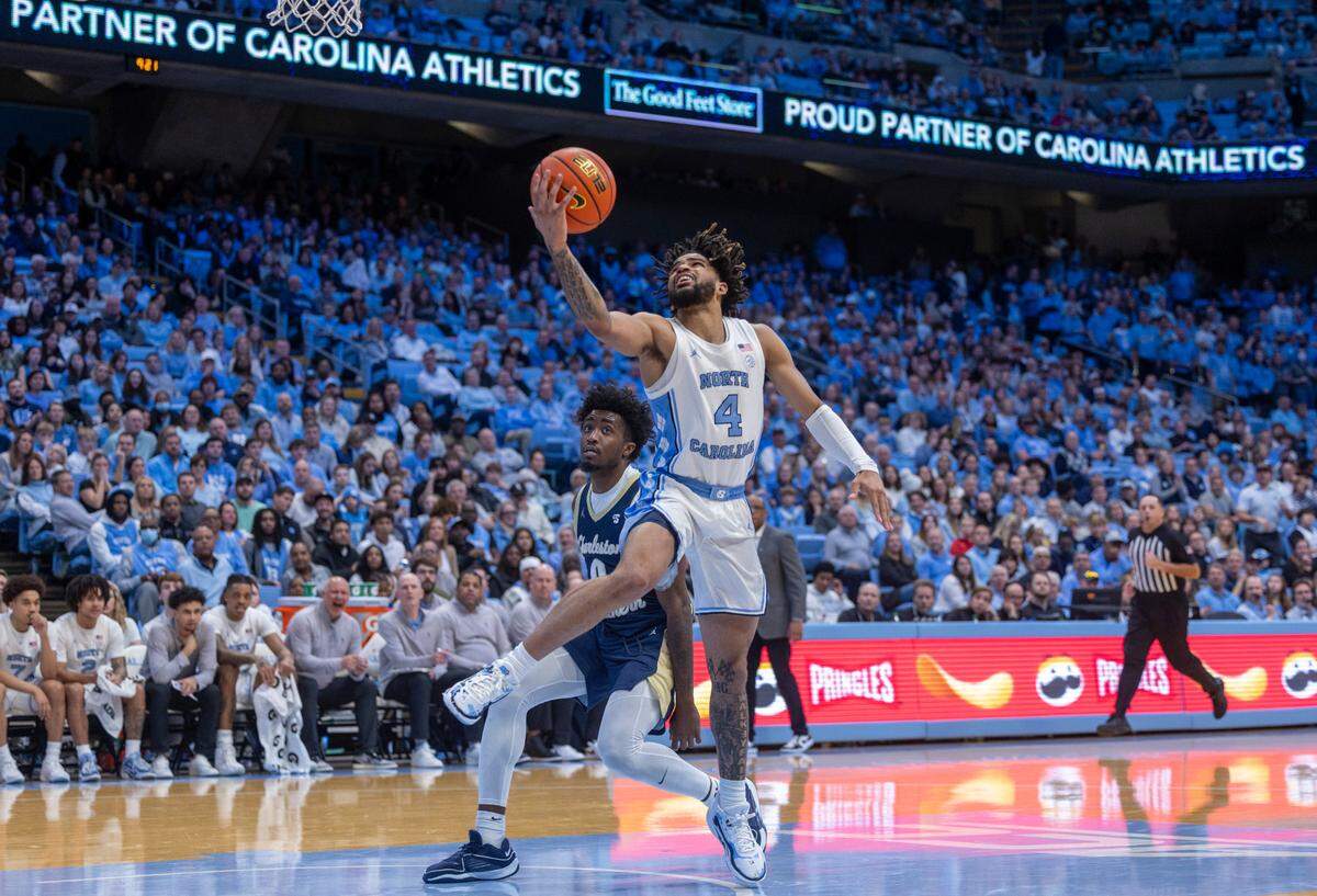 North Carolina’s R.J. Davis (4) breaks to the basket against Charleston Southern’s Gaddis Heath III (0) in the second half on Friday, December 29, 2023 at the Smith Center in Chapel Hill, N.C. Davis led the Tar Heels with 20 points and 10 assists.