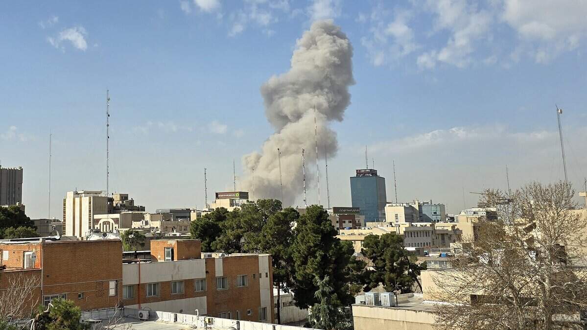 A plume of smoke rises after an explosion on February 28, 2026 in Tehran, Iran. After explosions were seen in the Iranian capital, the office of the Israeli Defense Minister issued a statement saying it had launched a preemptive strike against the country.