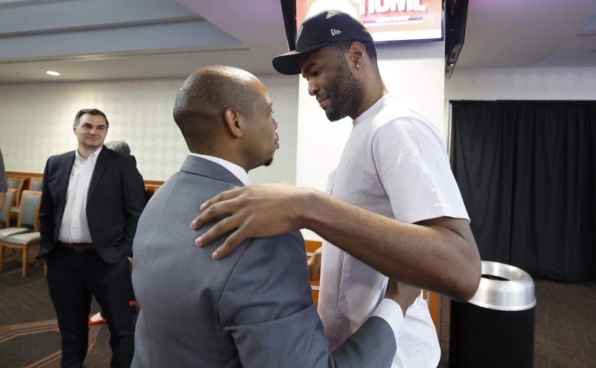 New N.C. State head men’s basketball coach Justin Gainey talks with Wolfpack great T.J. Warren after a press conference at the Lenovo Center where Gainey was officially introduced as the new head coach Wednesday, April 1, 2026.