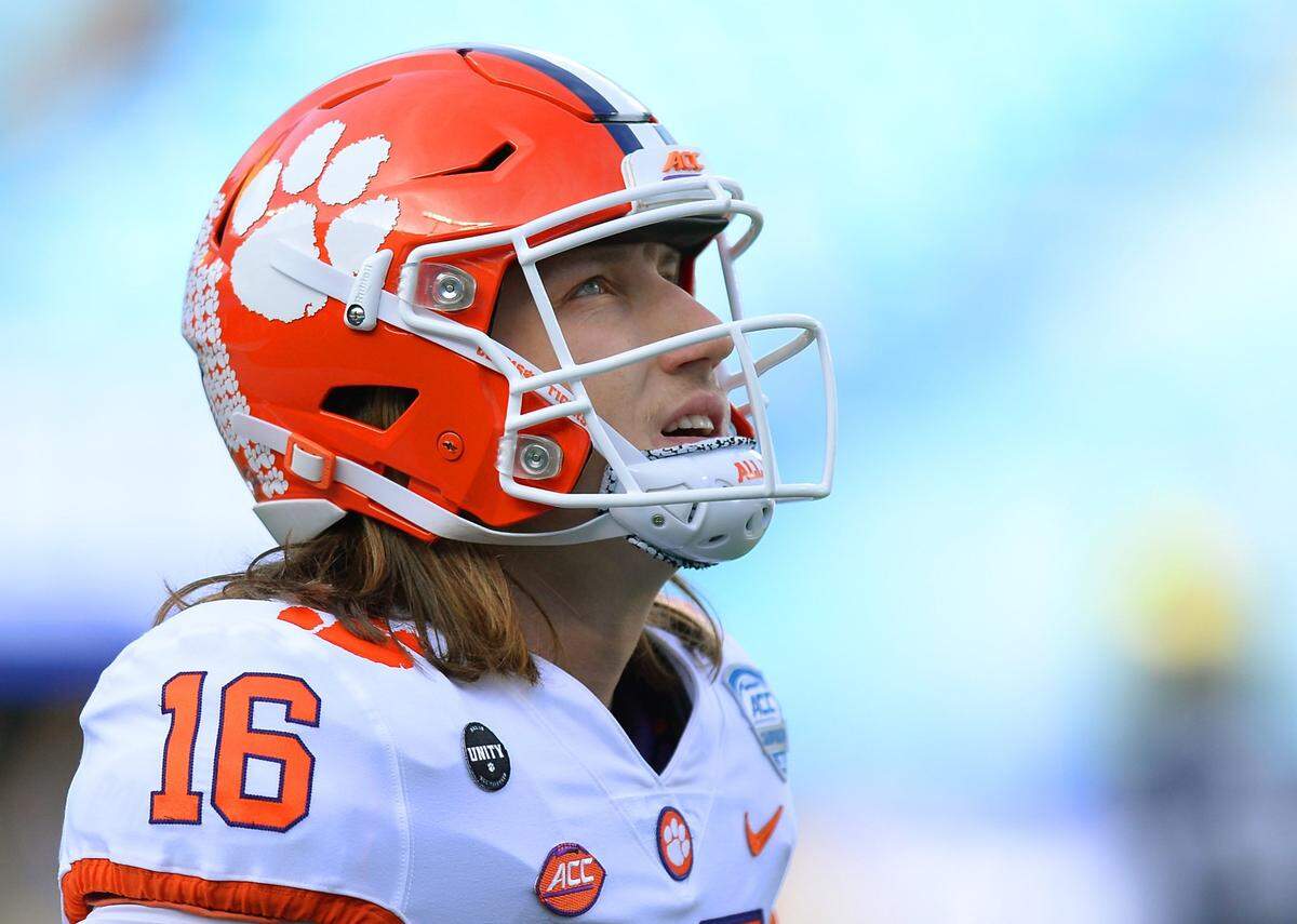 Clemson Tigers quarterback Trevor Lawrence glances up at the scoreboard Saturday night. Clemson coach Dabo Swinney said after the game that it would be a “crying shame” if Lawrencec didn’t win the Heisman Trophy.