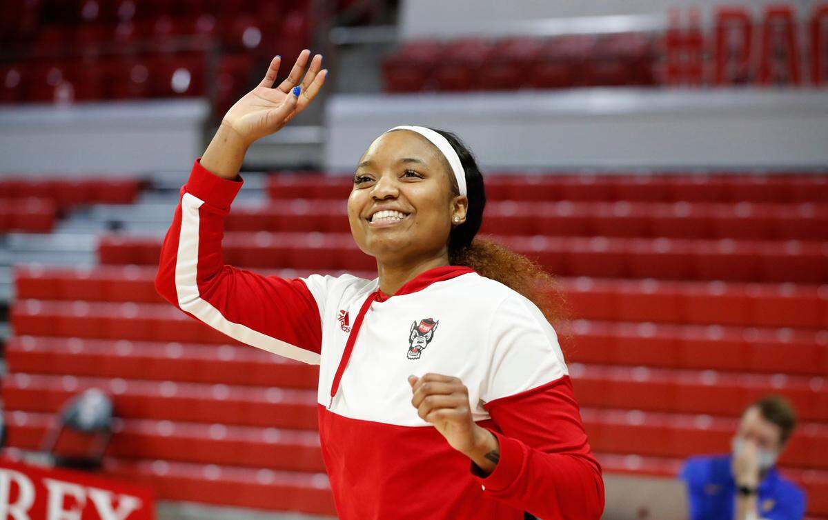 N.C. State’s Kayla Jones (25) waves to the spectators after being introduced during senior day activities before N.C. State’s game against Pittsburgh at Reynolds Coliseum in Raleigh, N.C., Thursday, February 25, 2021.