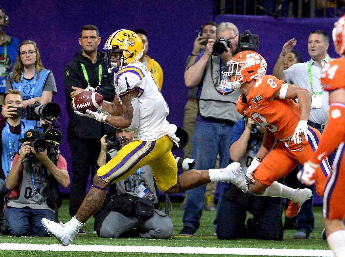 LSU Tigers wide receiver Ja’Marr Chase, left, catches a touchdown pass from quarterback Joe Burrow as Clemson Tigers cornerback A.J. Terrell, right, chases during second quarter action at the Mercedes-Benz Superdome in New Orleans, LA. on Monday, January 13, 2020. Clemson and LSU battled in the College Football Playoff National Championship.