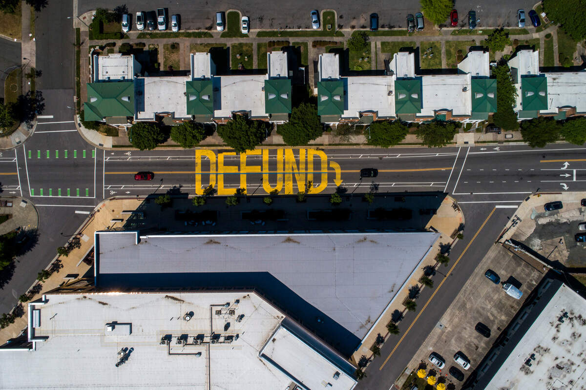 The word ‘DEFUND’ was painted in yellow on East Main Street in front of the Durham Police Headquarters building in 2020 and part of 2021.