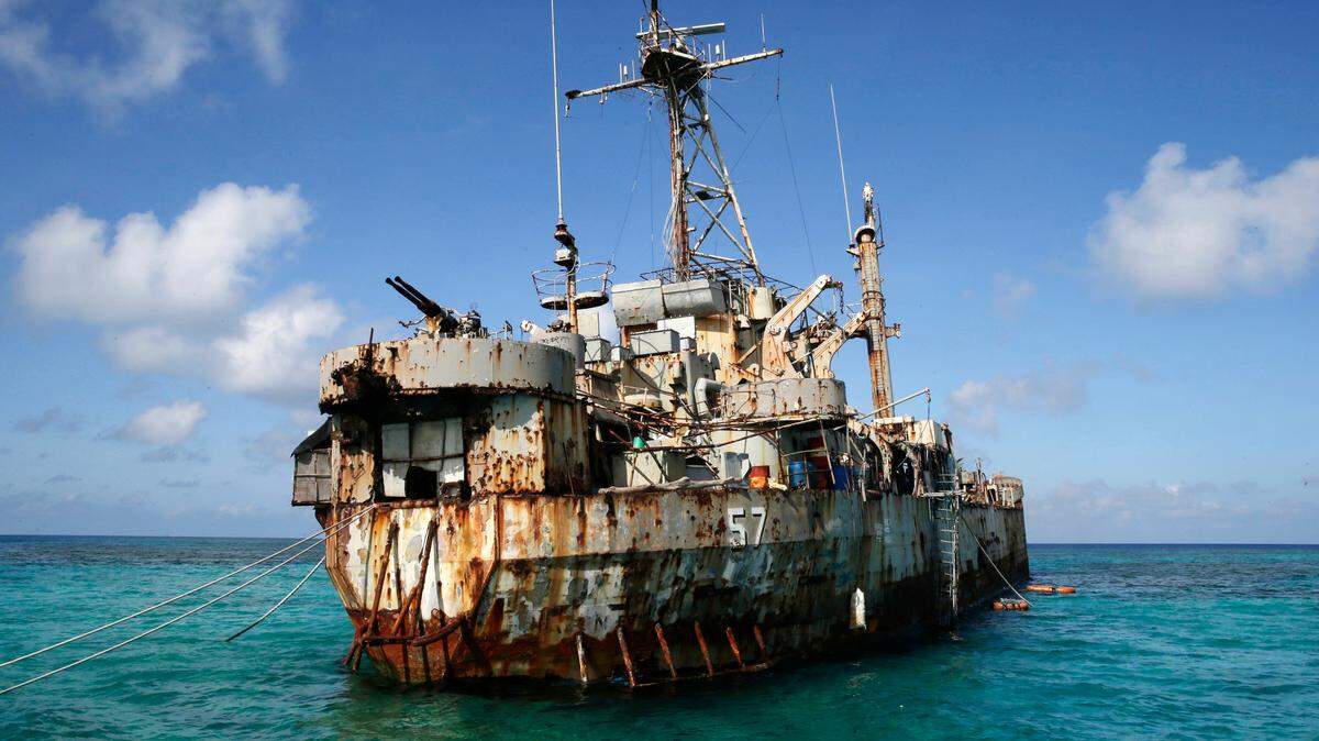 In this March 30, 2014, file photo, the dilapidated Philippine Navy ship LT 57 Sierra Madre is in the shallow waters of Second Thomas Shoal in the South China Sea. 