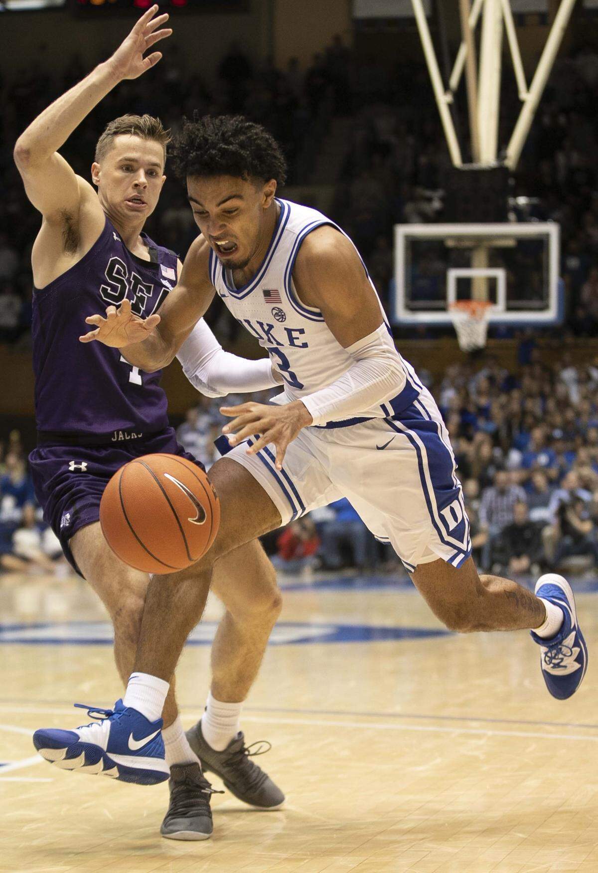 Duke’s Tre Jones (3) looses control fo the ball as he drives against Stephen F. Austin’s David Kachelries (4) in the second half on Tuesday, November 26, 2019 at Cameron Indoor Stadium in Durham, N.C.