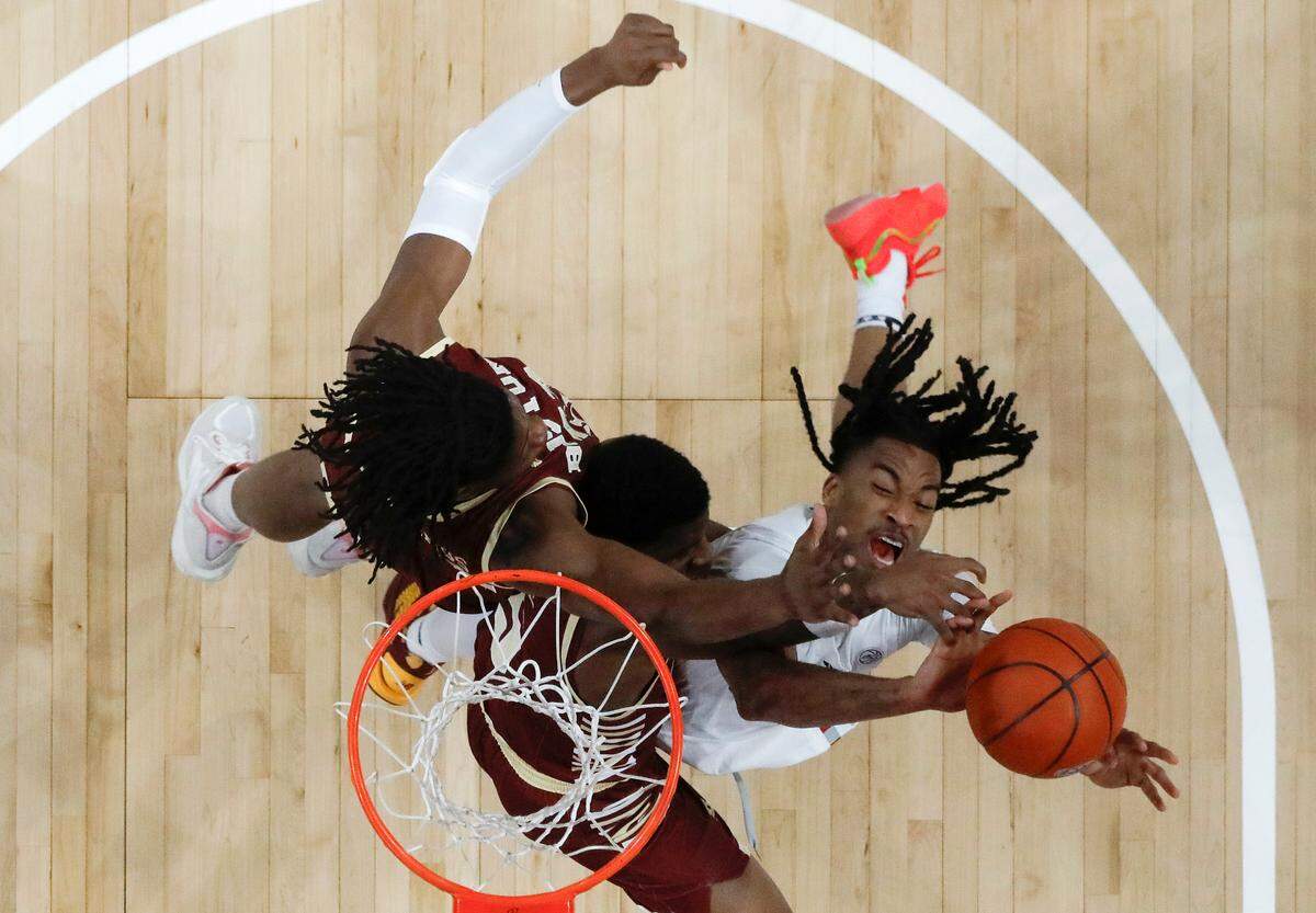 N.C. State’s Jayden Taylor drives to the basket against Boston College’s Jayden Hastings and Fred Payne during the first half of the Wolfpack’s 70-62 win on Saturday, Feb. 15, 2025, at Lenovo Center in Raleigh, N.C.