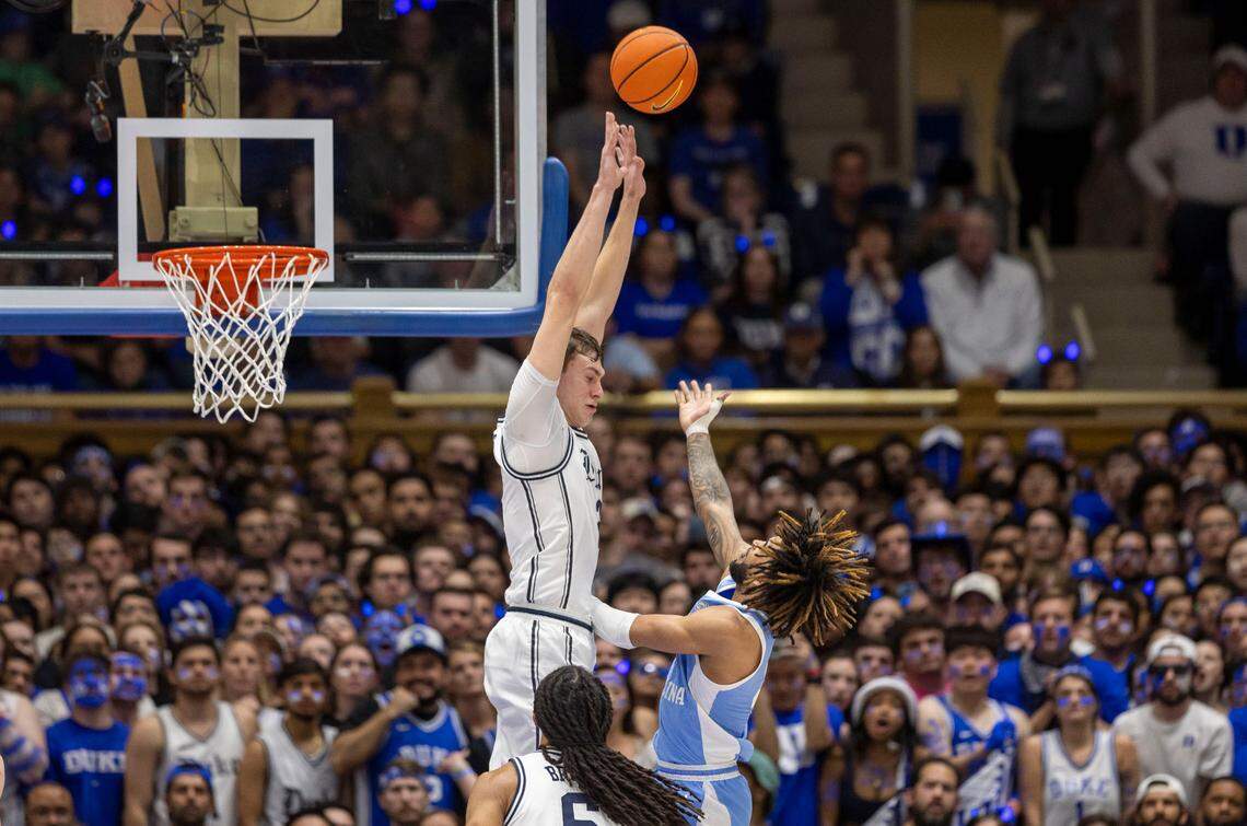 North Carolina guard R.J. Davis (4) scores his first basket of the game late in the first half against Duke’s Cooper Flagg (2) on Saturday, February 1, 2025 at Cameron Indoor Stadium in Durham, N.C.