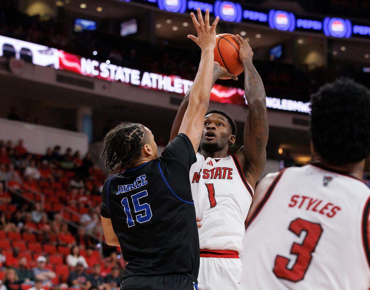 N.C. State’s Brandon Huntley-Hatfield looks to shoot over Presbyterian’s Jonah Pierce during the second half of the Wolfpack’s 81-72 win on Friday, Nov. 8, 2024, at Lenovo Center in Raleigh, N.C.