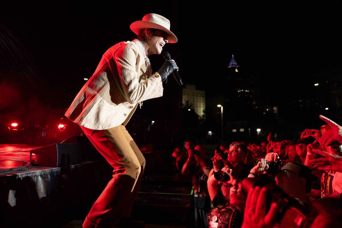 Perry Farrell connects with the crowd at the barricade as Jane’s Addiction performs at Raleigh, N.C.’s Red Hat Amphitheater, Tuesday night, Sept. 3, 2024.