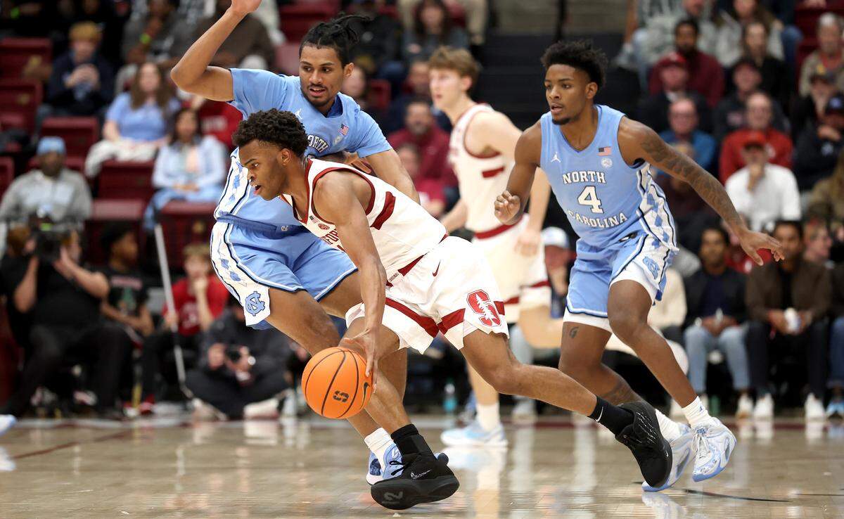 Ebuka Okorie #1 of the Stanford Cardinal is guarded by Jarin Stevenson #15 of the North Carolina Tar Heels during the second half at Stanford Maples Pavilion on January 14, 2026 in Palo Alto, California. 