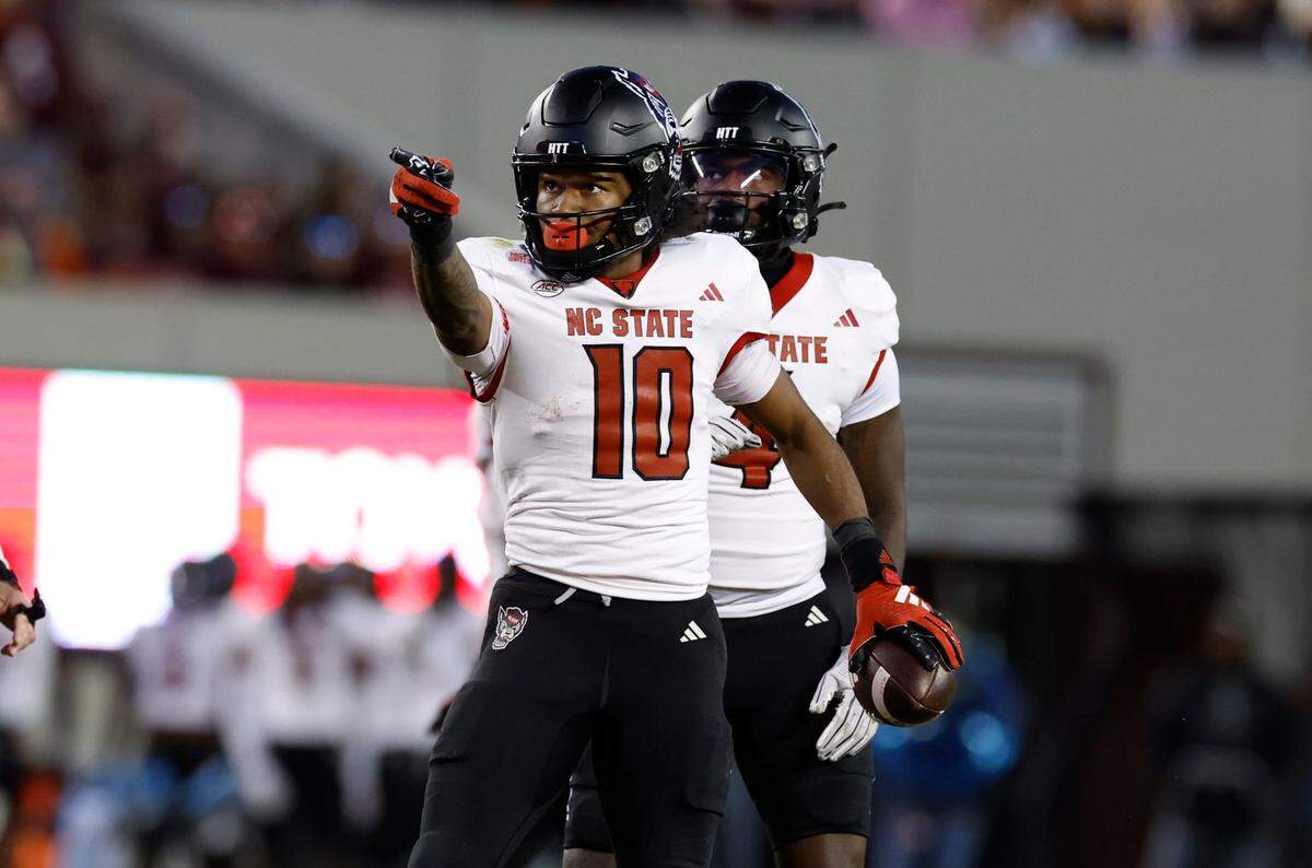 N.C. State wide receiver KC Concepcion (10) signals for a first down after making the reception during the second half of N.C. State’s 35-28 victory over Virginia Tech at Lane Stadium in Blacksburg, VA, Saturday, Nov. 18, 2023.