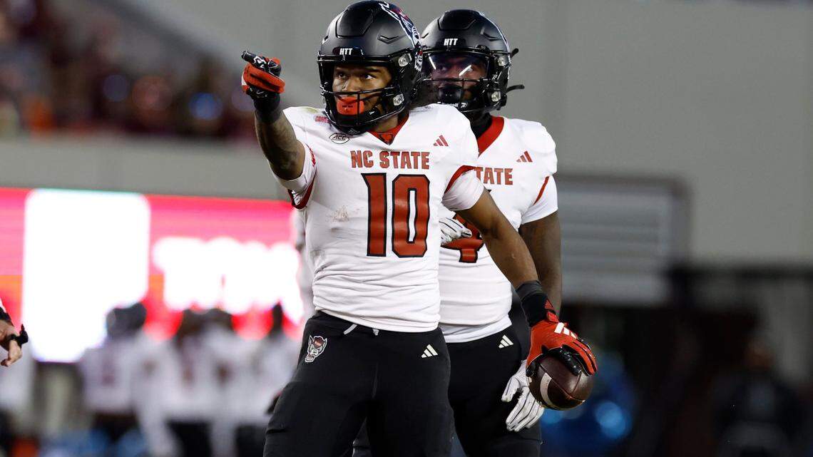 N.C. State wide receiver KC Concepcion (10) signals for a first down after making the reception during the second half of N.C. State’s 35-28 victory over Virginia Tech at Lane Stadium in Blacksburg, VA, Saturday, Nov. 18, 2023.