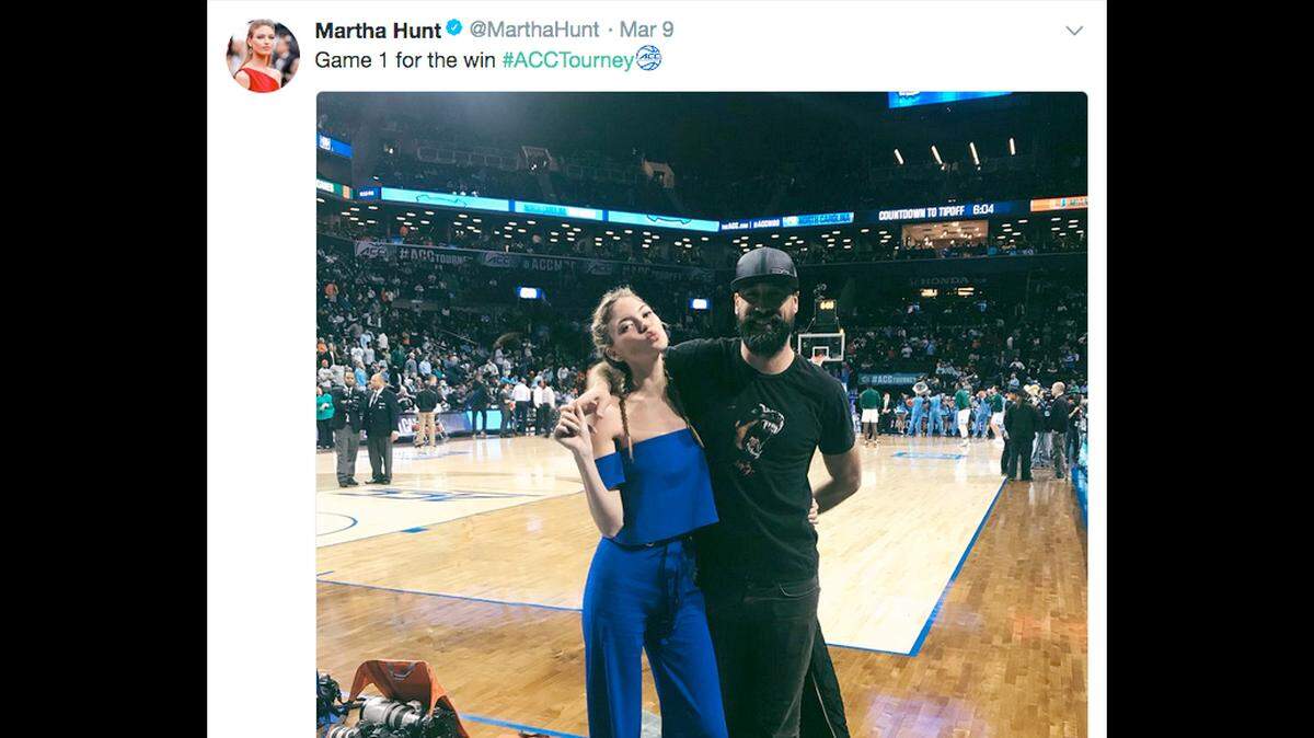 A screenshot of a photo posted by Victoria's Secret Angel Martha Hunt showing her with a friend on the court at Barclays Center in Brooklyn, N.Y. during the ACC Tournament, wearing Duke blue.