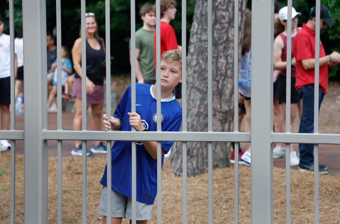 Alec McFalls, 12, of Charleston, SC waits to get into Kenan Stadium before Chelsea FC’s international friendly match against Wrexham FC in Chapel Hill, N.C., Wednesday, July 19, 2023.