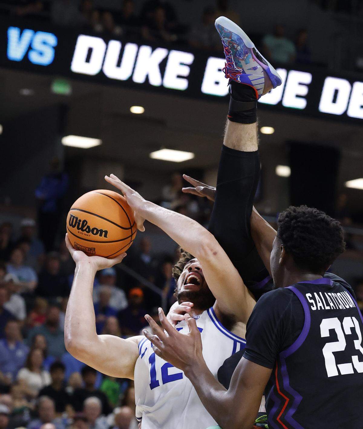 TCU’s Tanner Toolson (55) is called for a technical foul as he runs into Duke’s Cameron Boozer (12) in the second half of Duke’s 81-58 victory over TCU in the second round of the NCAA Men’s Basketball Tournament at  Bon Secours Wellness Arena in Greenville, S.C., Saturday, March 21, 2026.