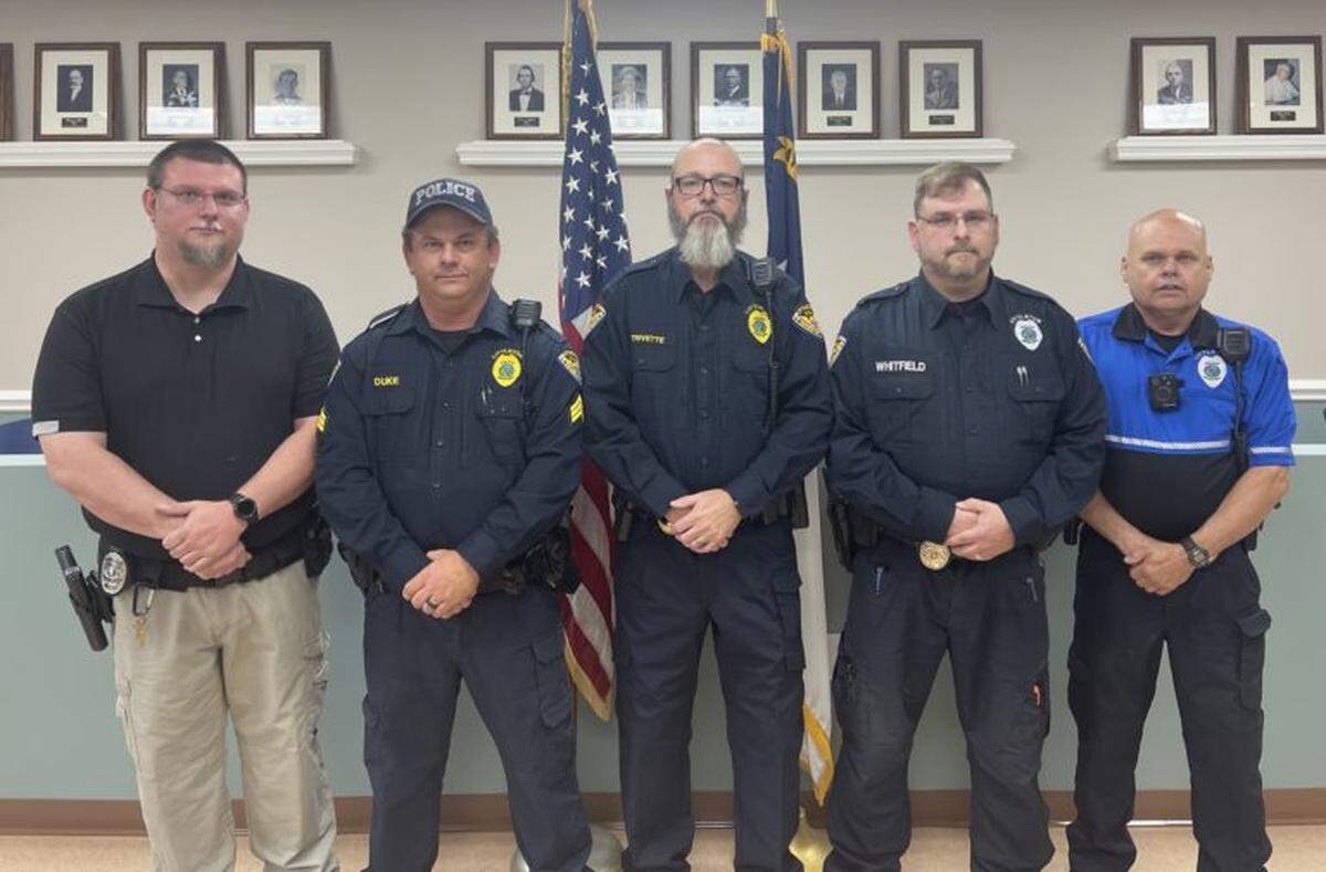 Mark Oakley, on the left, resigned from the town of Littleton after he was indicted on federal charges.