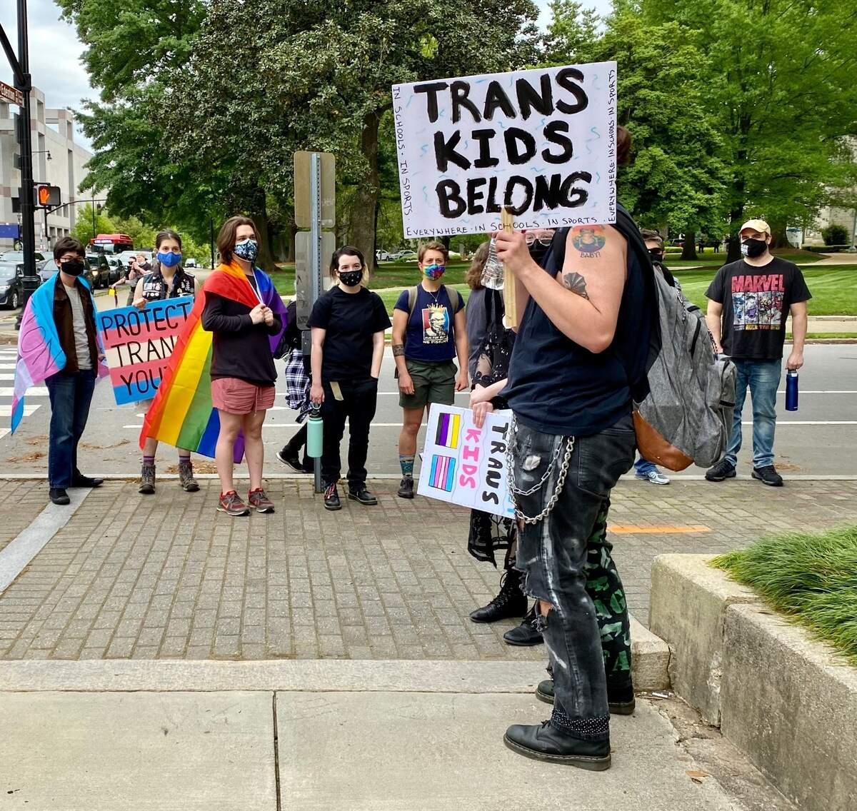 Protestors stop at a downtown Raleigh street corner on Saturday during a demonstration against Senate Bill 514, which would bar doctors from providing gender-affirming treatment to transgender people younger than 21.