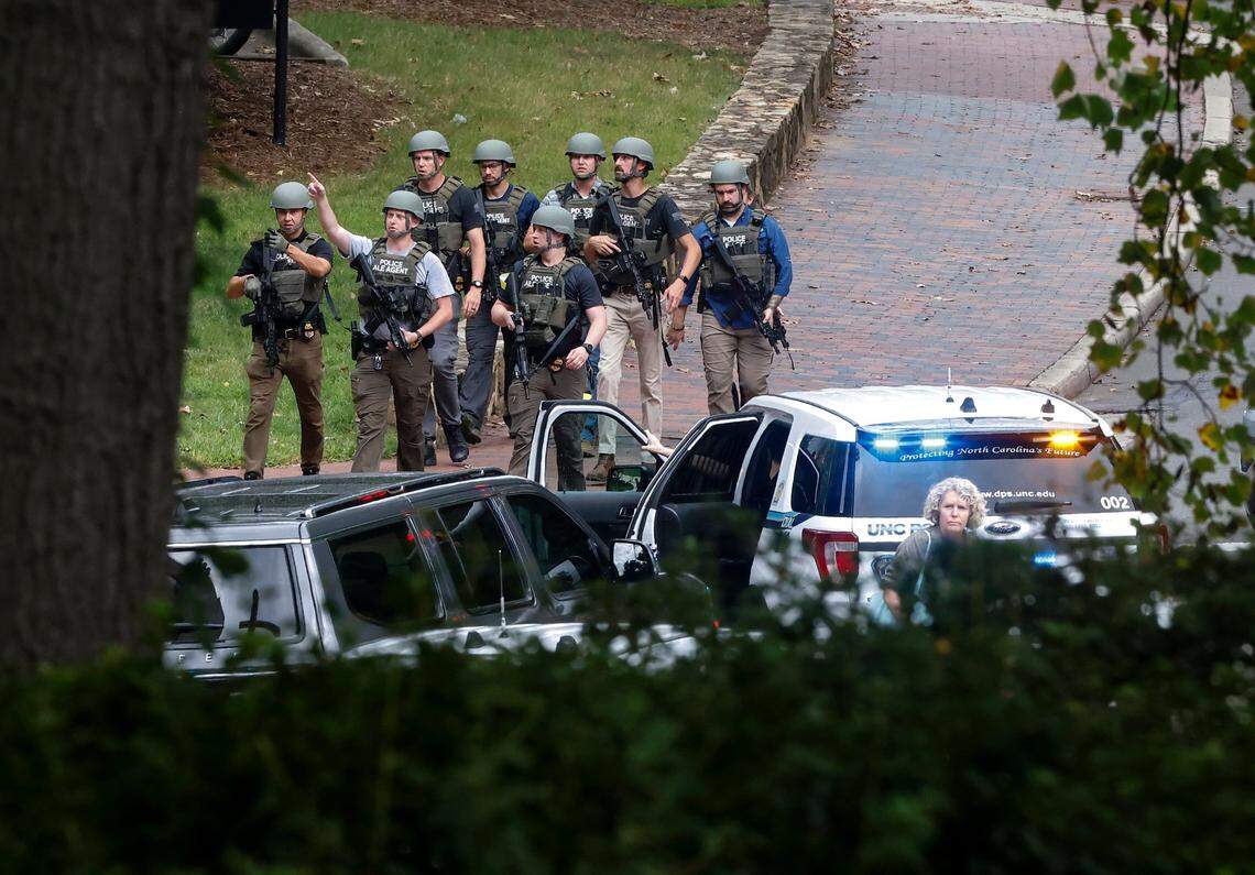 Law enforcement gather along South Road while responding to an “active assailant situation” on the campus of UNC-Chapel Hill on Monday, Aug. 28, 2023.