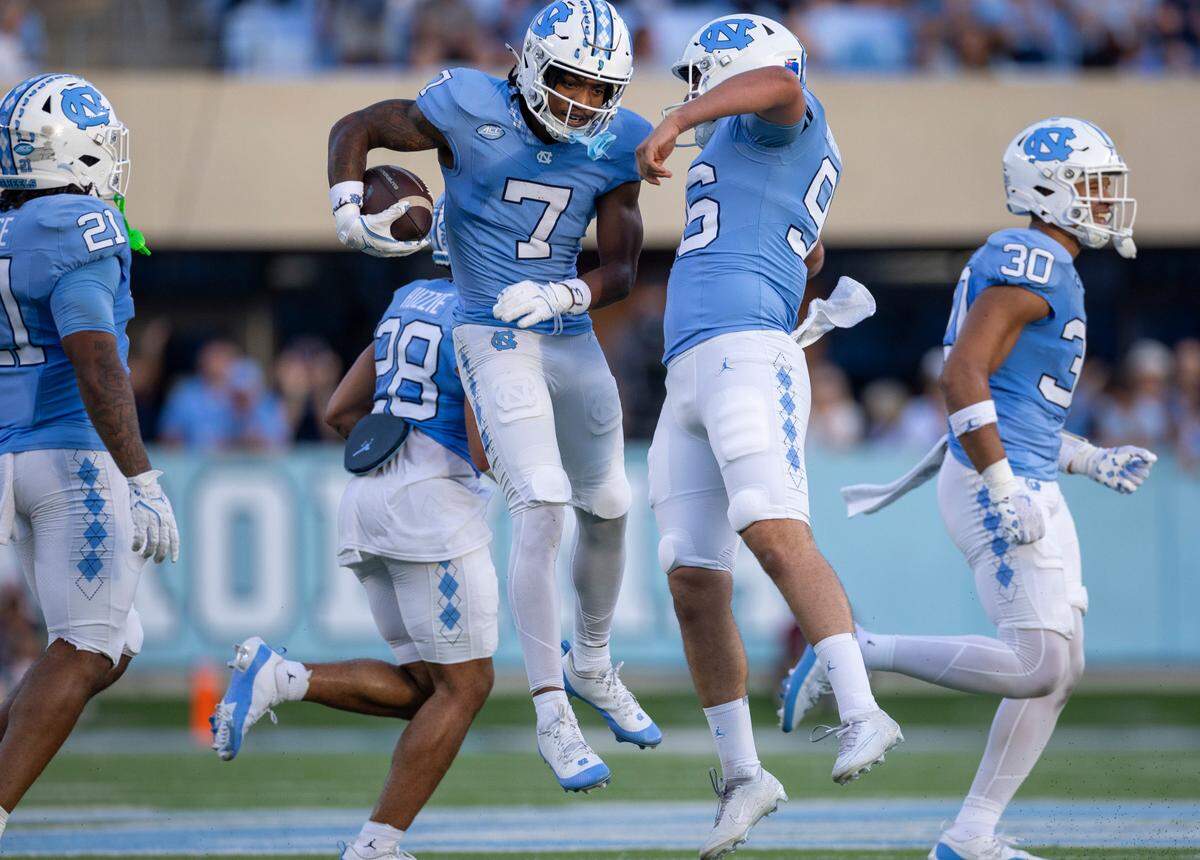 North Carolina’s Christian Hamilton (7) and punter Tom Maginness (96) react after Hamilton recovered a fumble by North Carolina Central on a punt return in the first quarter on Saturday, September 14, 2024 at Kenan Stadium in Chapel Hill, N.C.