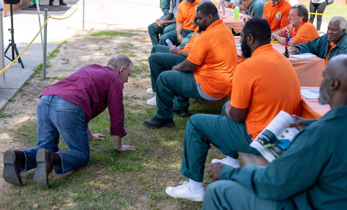 Entrepreneur and motivational speaker Brian Hamilton illustrates for inmates at Sanford Correctional Center how to think about starting your own business. Start at very bottom, take baby steps and slowly build your business, Hamilton advised during a visit on Monday, May 19, 2025 in Sanford, N.C.