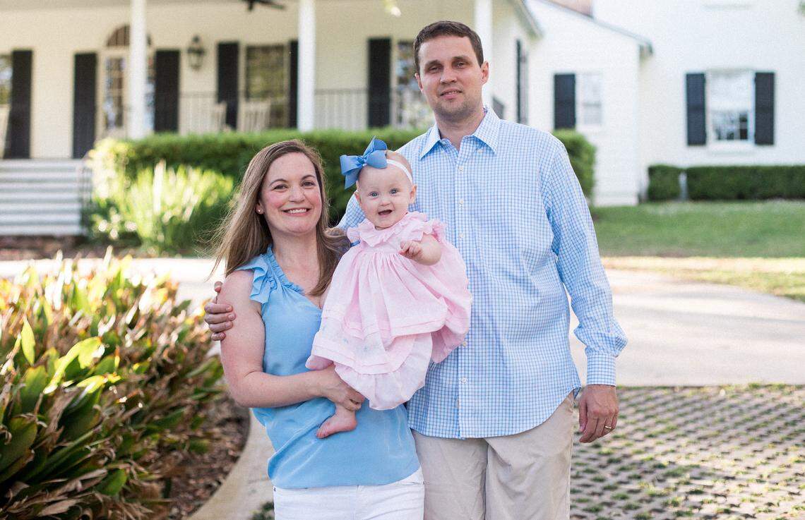 Will and Lauren Wade hold their daughter, Caroline, for family portraits in April 2018 during a photo shoot in Baton Rouge, Louisiana. At the time, Will Wade was the head coach at LSU.
