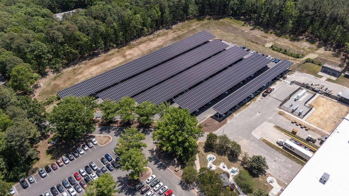 The solar panels over the parking lot of the Siemens plant in Wendell, North Carolina, generate 100% of the power the company needs on site.