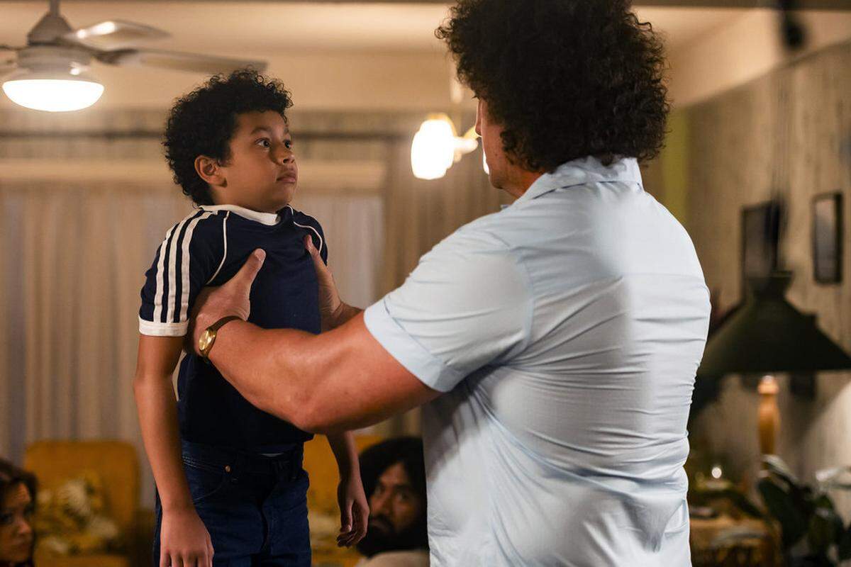 Adrian Groulx as young Dwayne Johnson and Matthew Willig (right) as “Andre The Giant” are two of the stars in the NBC comedy “Young Rock.” Willig played 29 games for the Panthers during a 14-year NFL career.